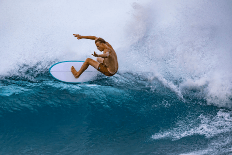 Surfer makes Top Turn with Torq Hybrid Surfboard